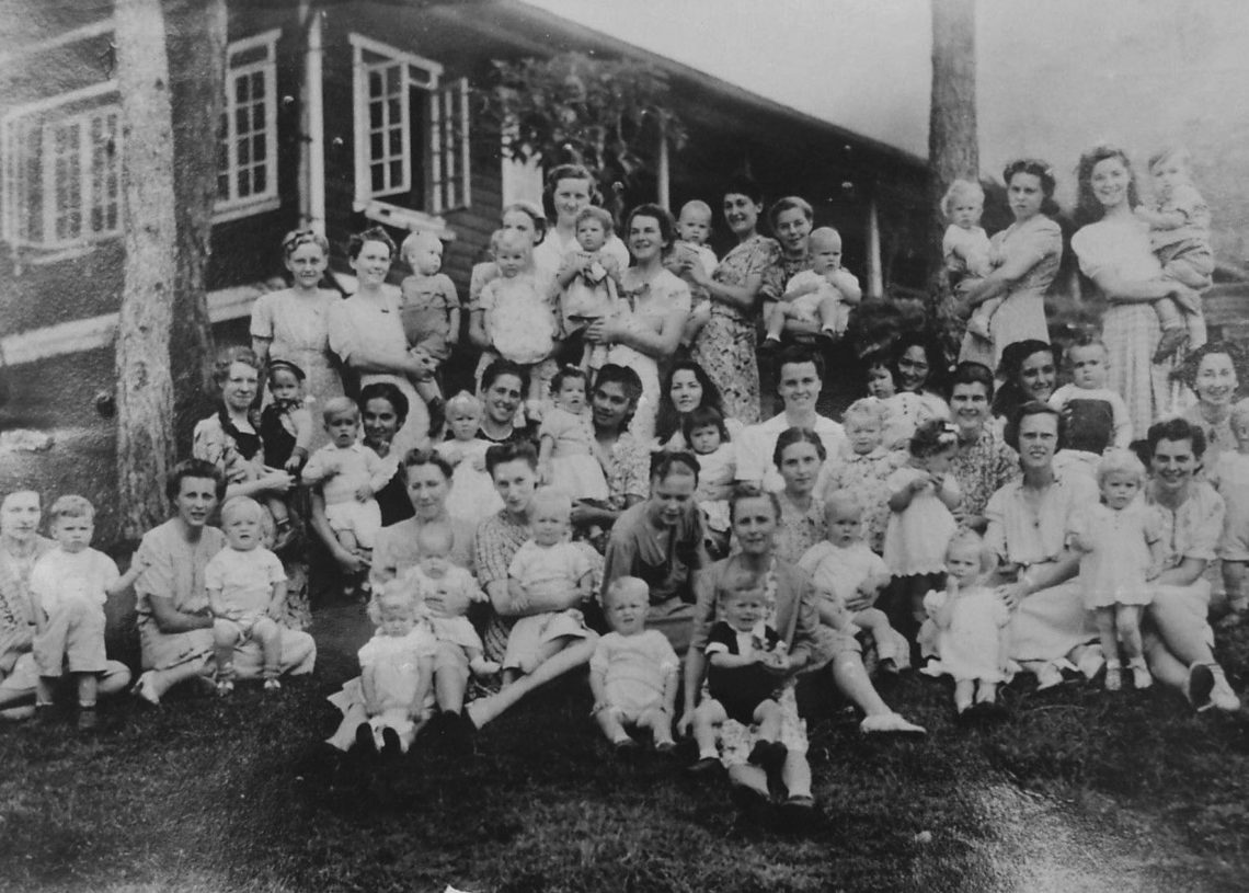 Expats staying at Camp Holmes, an WWII internment camp in Baguio City, Philippines, gathered in a group photograph.  