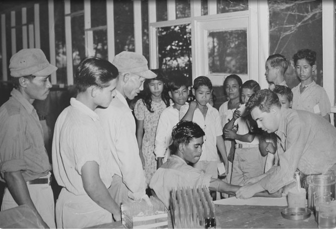 Medical staffers are seen providing medical and dental services to Tinian residents during USS Whidbey's tour of the islands in 1949. Photo courtesy of Miconesian Seminar. 